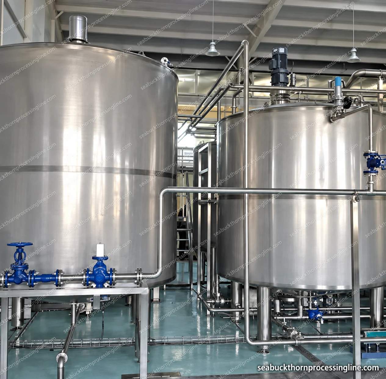 Two closed tanks with support legs and interconnecting process valves